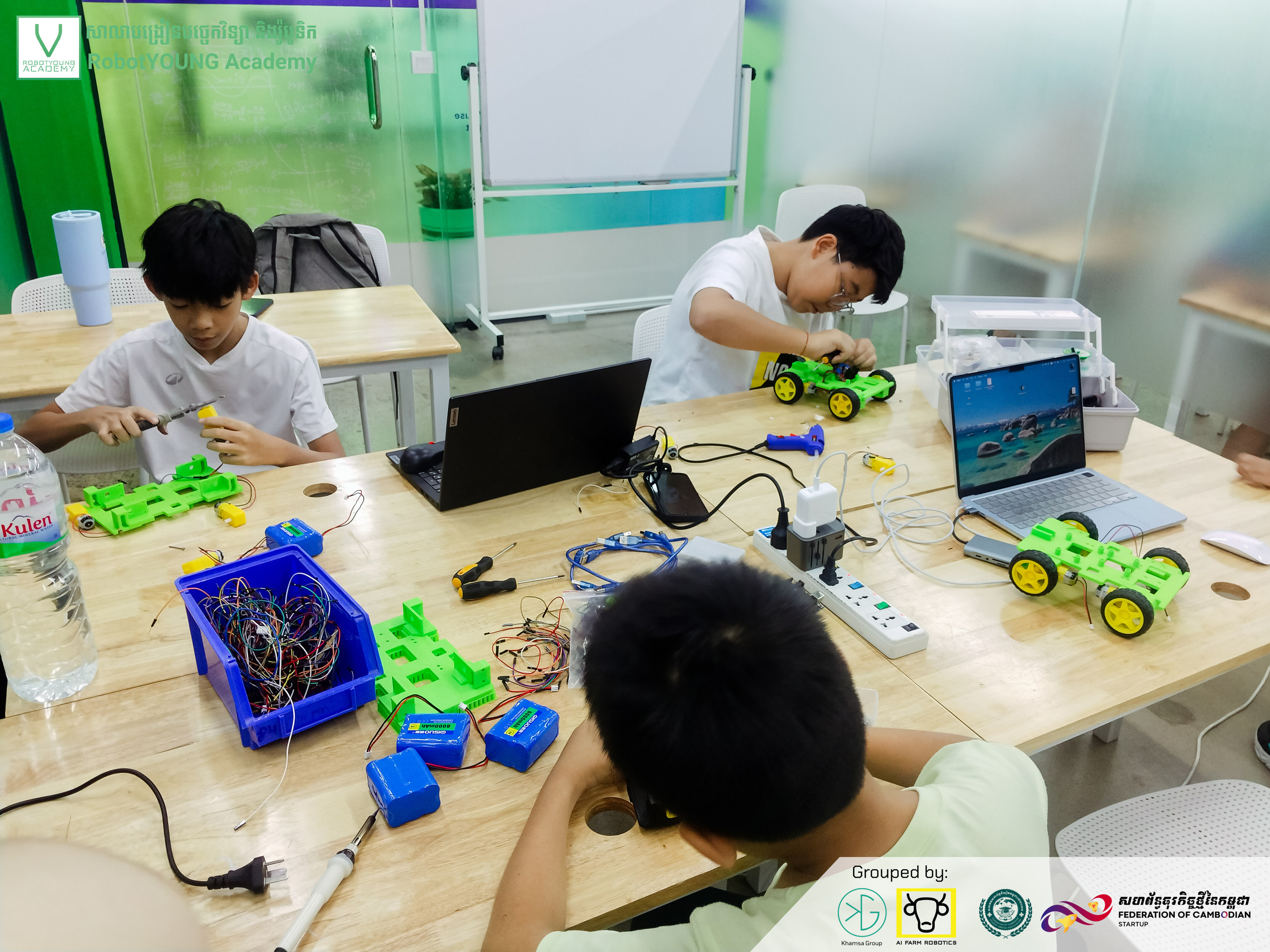 Students working on robots together in the classroom