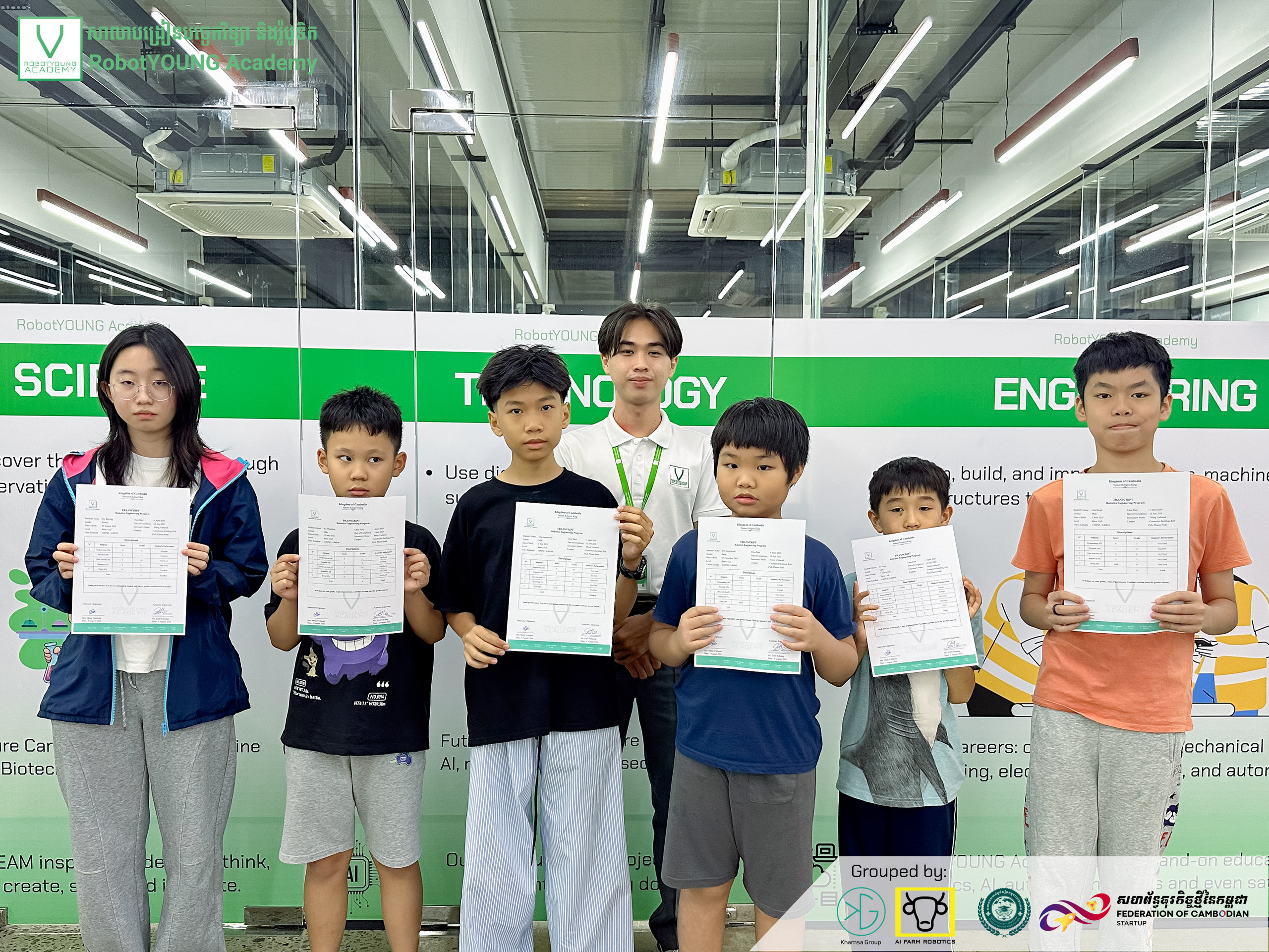Illustrative academy photo of children holding certificates beside an adult